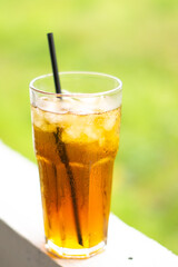 The fresh afternoon iced tea with a straw looks tempting