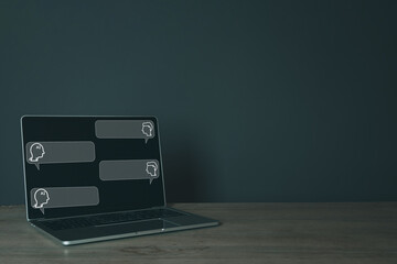 AI and human conversation chat bubble on laptop screen over black background with copyspace, symbolizing innovation, technology, and artificial intelligence