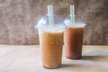 Cold cappuccino iced drink in plastic cup