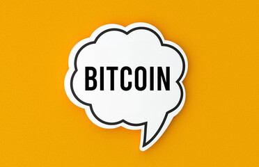 Bitcoin concept written in a speech bubble. Yellow background, illustration.