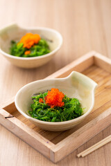 Fresh Seaweed Salad with Toppings in Bowls