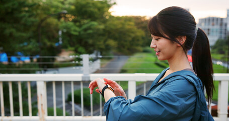 Fitness, smart watch and happy woman in city to check training results, performance or steps....
