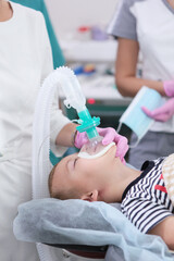 Preparation for dental surgery for the removal and treatment of baby teeth. General anesthesia. An artificial lung ventilation device.