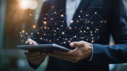 A businessman using a tablet with digital network connections illustrated above.