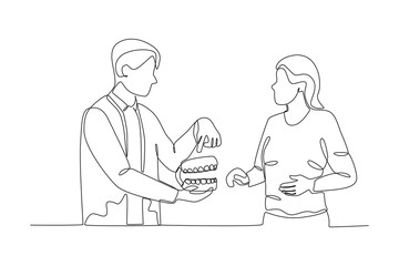 Single continuous line drawing of Dentist explaining about dentures to patient, dental concept.  Dynamic single line draw design graphic vector illustration.
