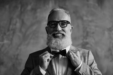 Close up portrait of joyful excited with toothy beaming smile stylish trendy grey-haired groomed sharp dressed elegant smart handsome attractive entrepreneur choose bow-tie isolated on gray background