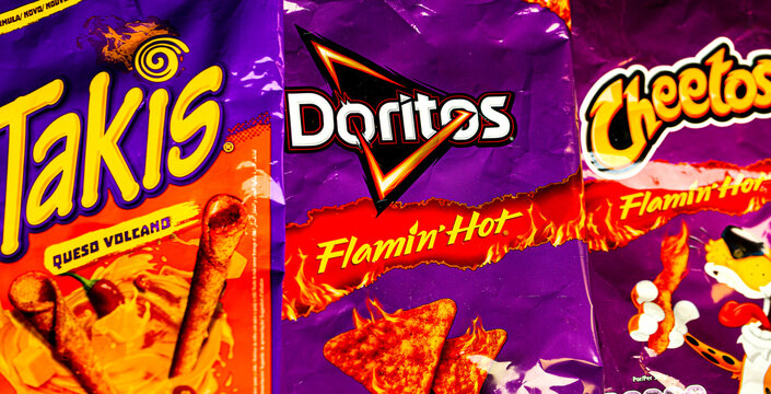 siegen, North Rhine Westphalia., germany - 18 11 2024: a hot doritos takis and cheetos packaging sign panorama