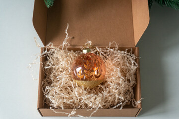 Christmas ball in a box. christmas greeting card. Christmas Decoration. Mock up. Top view.