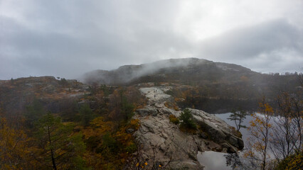 Misty Rocky Landscape with Calm Waters