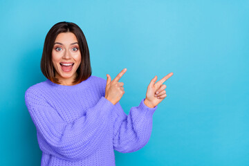 Portrait of attractive amazed cheerful girl demonstrating copy space ad new novelty isolated over...