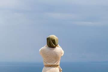 statue on the seaside cliff