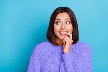 Portrait of attractive curious cheerful girl looking aside choosing copy space guess isolated over bright blue color background