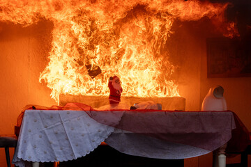 Simulation of a apartment fire caused by a Christmas wreath catching fire at the annual press conference of the Berlin fire department on fire protection during the Christmas season