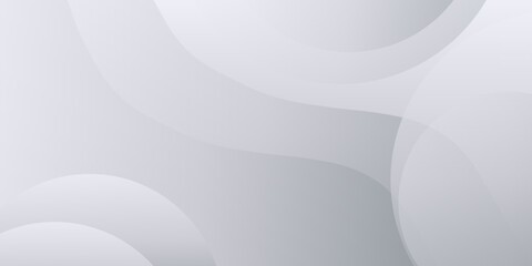 A smooth, flowing abstract background with soft, undulating curves in shades of gray