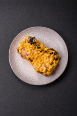 Sandwich with brioche, meat, melted cheese, corn, salt, spices and herbs