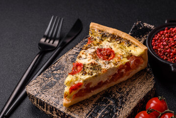Delicious crispy quiche cut into slices with cheese, broccoli, tomatoes