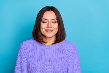 Portrait of attractive cheerful dreamy girl enjoying peace silence isolated over shine blue color background
