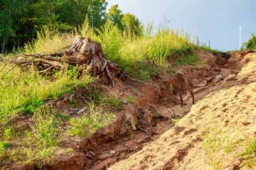 Rain erosion of sand slope near