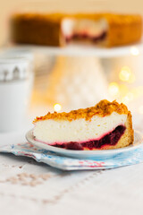 Homemade pie with cherry confit and sour cream souffle on laid table for tea party