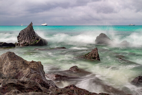 Surf breaking on lava shoreline at Gardner Bay on Espanola Island in the Galapagos Island Archipelago, UNESCO World Heritage Site, Ecuador