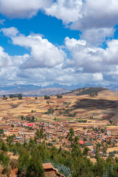Racchi village near Chinchero with distant views of Andes mountains, Sacred Valley, Peru