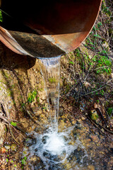 Water falling into a stream from a culvert