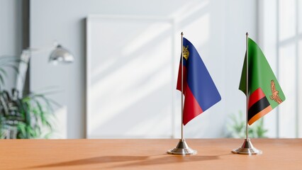 FLAGS OF LIECHTENSTEIN AND ZAMBIA ON TABLE