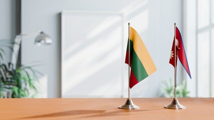 FLAGS OF LITHUANIA AND NEPAL ON TABLE