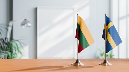 FLAGS OF LITHUANIA AND SWEDEN ON TABLE