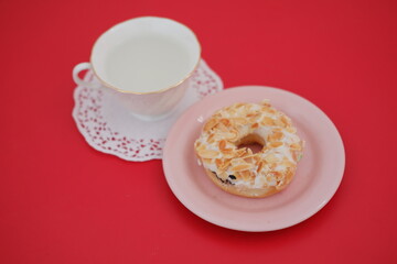 donut and cup on the red table