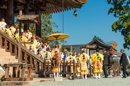 Buddhist monks in yellow robes at the temple, Yoshino autumn celebrations, festival to pray for a good harvest at the Tenmangu of Kinpusen-ji temple, Yoshino, Honshu, Japan