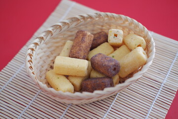 Crispy fried breadcrumbs in bamboo basket background