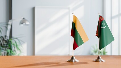 FLAGS OF LITHUANIA AND TURKMENISTAN ON TABLE