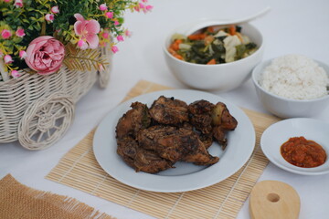 traditional Indonesian food arranged neatly on a white surface