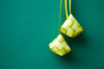 Ketupat is a traditional Indonesian food made from rice cooked in woven young coconut leaves or janur.