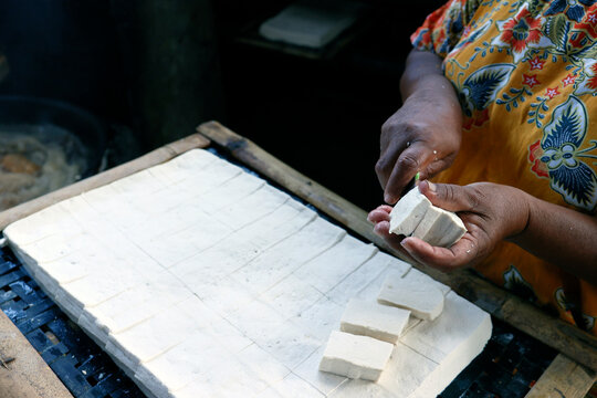 Worker making tofu, a food prepared by coagulating soy milk, in a traditional family factory, Yogyakarta, Java, Indonesia, Southeast Asia
