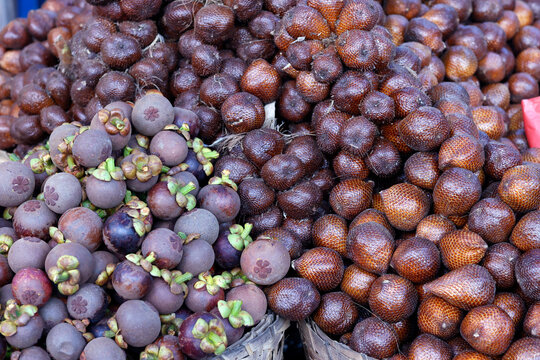 Mangosteen and salak fruit (snake fruit) for sale at local food market, Yogyakarta, Java, Indonesia, Southeast Asia
