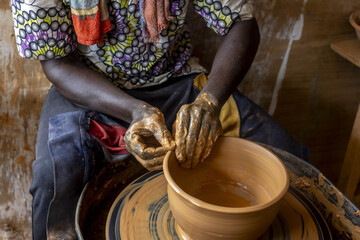 Potter at work in Kpalime, Togo, West Africa