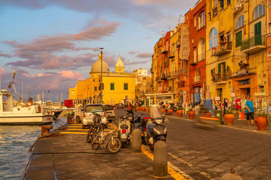 View of Church of Santa Maria della Pieta in the fishing port Marina Grande with shops at golden hour, Procida, Phlegraean Islands, Gulf of Naples, Campania, Southern Italy, Italy