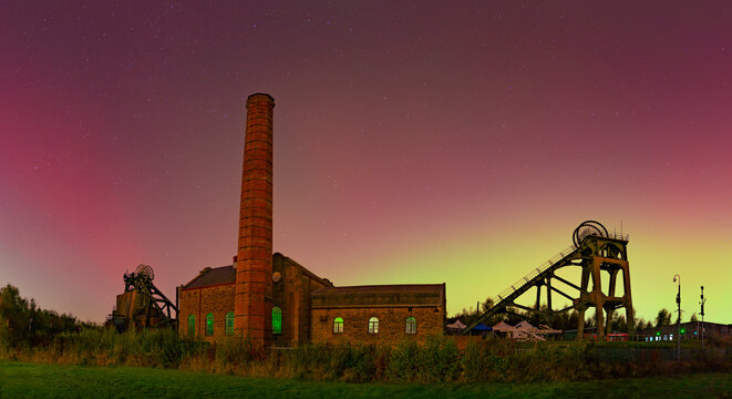 View of Northern Lights (Aurora borealis) and Pleasley Colliery Headstocks, Bolsover, Derbyshire, England, United Kingdom