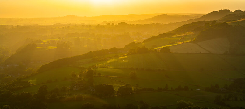View of landscape from Curbar Edge at sunset, Peak District National Park, Baslow, Derbyshire, England, United Kingdom