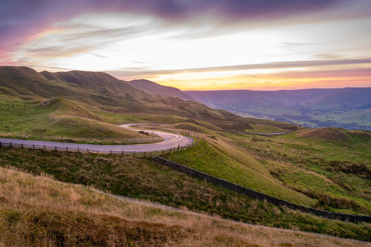 View of landscape and trail lights in the Hope Valley at sunset, Peak District National Park, Baslow, Derbyshire, England, United Kingdom