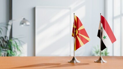 FLAGS OF MACEDONIA AND SYRIA ON TABLE