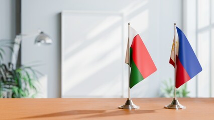 FLAGS OF MADAGASCAR AND PHILIPPINES ON TABLE