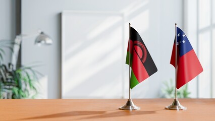 FLAGS OF MALAWI AND SAMOA ON TABLE
