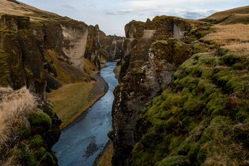 Obraz premium Mountain river in Fjadrargljufur Canyon. Travel to Iceland. Beautiful scenery. Icelandic landscape.