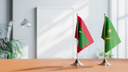 FLAGS OF MALDIVES AND MAURITANIA ON TABLE