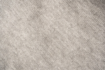 Grey wool sweater texture as a background.