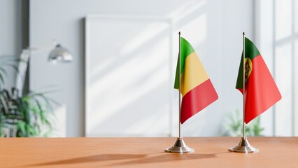 FLAGS OF MALI AND PORTUGAL ON TABLE