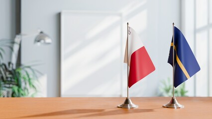 FLAGS OF MALTA AND NAURU ON TABLE